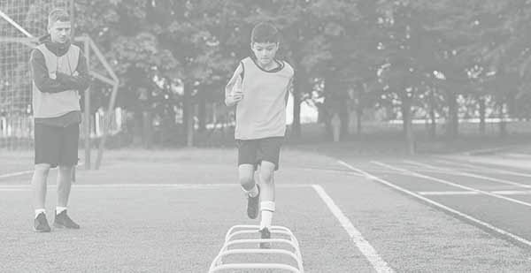 Children’s football players during team training before an important match. Exercises for the youth football team.